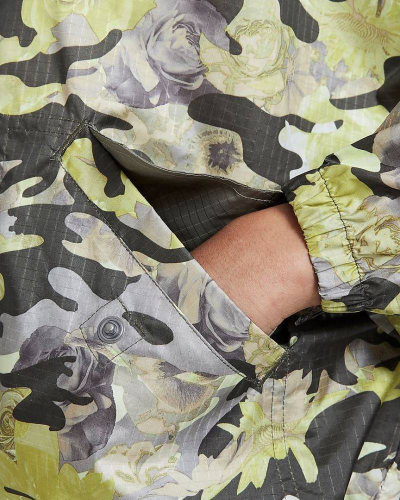 NIKE WOMENS WOVEN ALL-OVER-PRINT P&G JKT