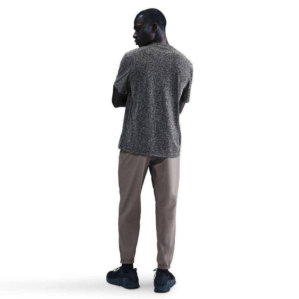 NIKE DRI-FIT TAPERED VERSALITE TROUSERS